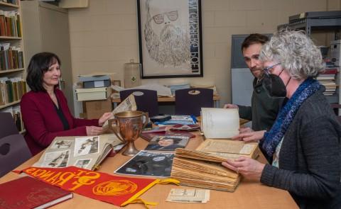 UNE archivists examine the Featherman collection